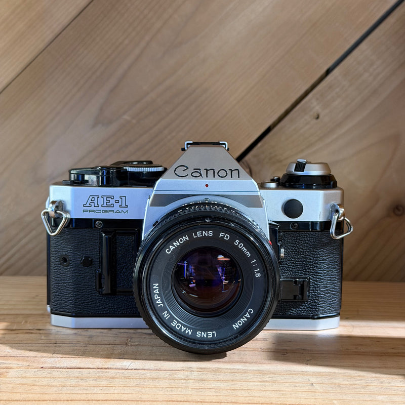 Canon AE-1 Program 35mm SLR Film Camera w/ Canon FD 50mm f/1.8 Lens (4346386)