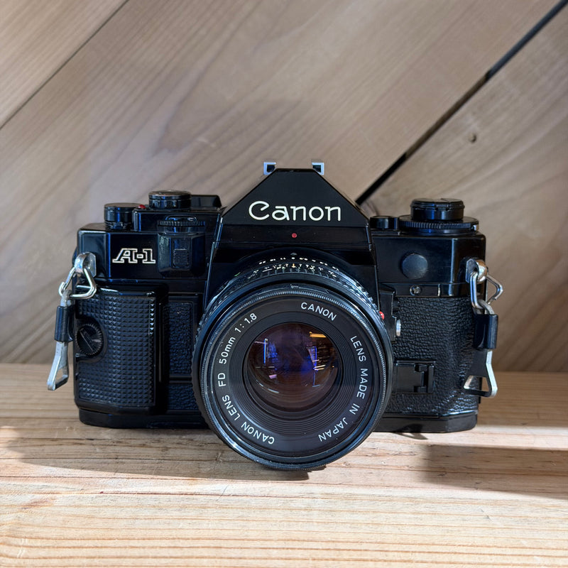 Canon A-1 35mm SLR Film Camera w/ Canon FD 50mm f/1.8 Lens (1929560) (Black Body)