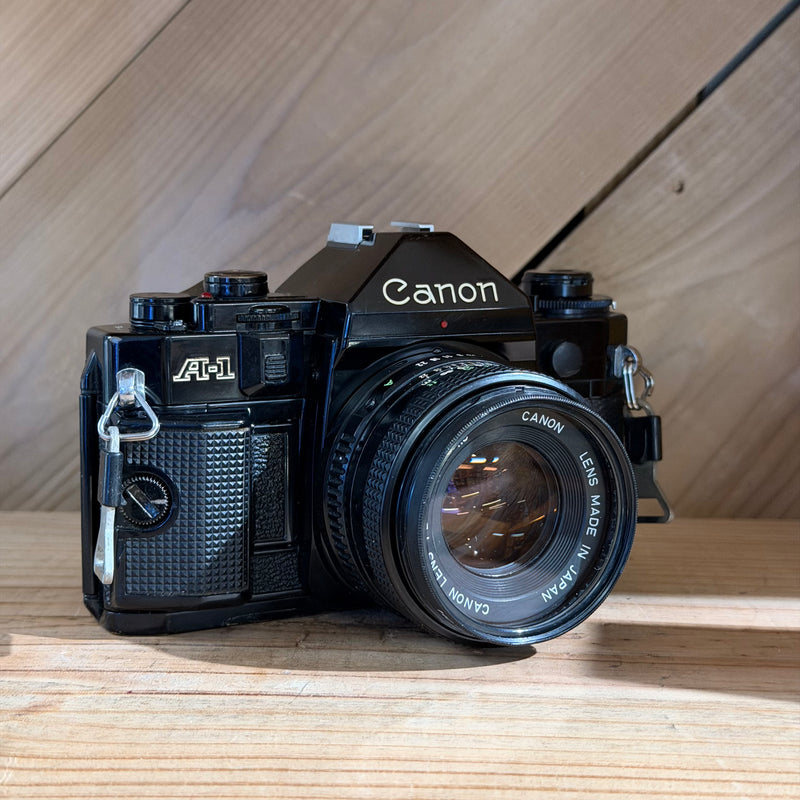 Canon A-1 35mm SLR Film Camera w/ Canon FD 50mm f/1.8 Lens (1929560) (Black Body)
