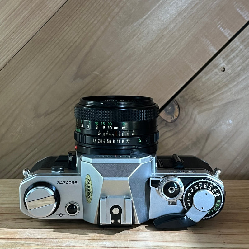 Canon AE-1 35mm SLR Camera w/ 50mm f/1.8 Lens (3474096)