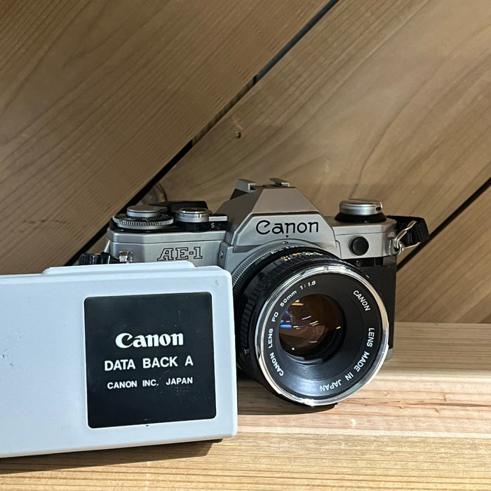 Canon AE-1 35mm SLR w/ Canon FD 50mm f/1.8 Lens + Canon Data Back A (2939092)