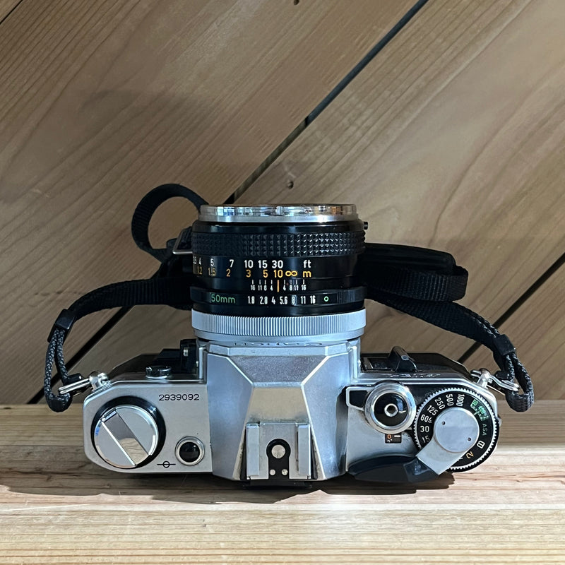 Canon AE-1 35mm SLR w/ Canon FD 50mm f/1.8 Lens + Canon Data Back A (2939092)