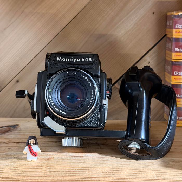 Mamiya 645 Medium Format SLR + Mamiya-Sekor C 80mm f/2.8 + Eye-Level Finder + Deluxe L-Grip Holder