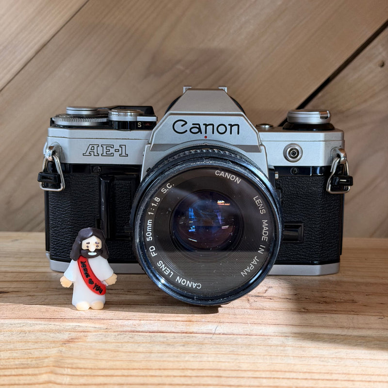 Canon AE-1 35mm SLR Film Camera w/ Canon FD 50mm f/1.8 Lens (4517252)