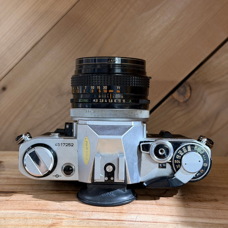 Canon AE-1 35mm SLR Film Camera w/ Canon FD 50mm f/1.8 Lens (4517252)