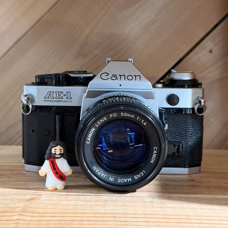 Canon AE-1 Program 35mm SLR Film Camera w/ Canon FD 50mm f/1.4 Lens (4698597)