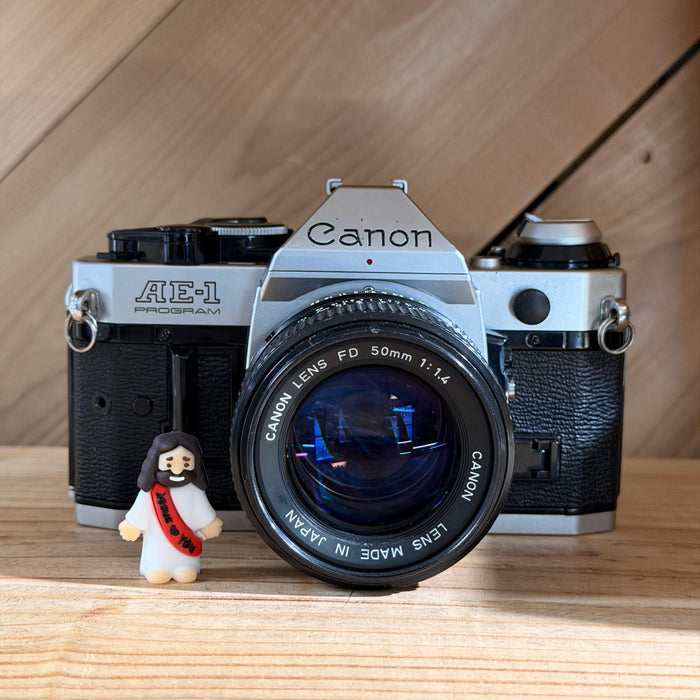 Canon AE-1 Program 35mm SLR Film Camera w/ Canon FD 50mm f/1.4 Lens (4698597)