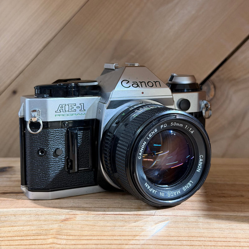Canon AE-1 Program 35mm SLR Film Camera w/ Canon FD 50mm f/1.4 Lens (4698597)