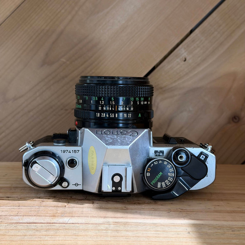 Canon AE-1 Program 35mm SLR Film Camera w/ Canon FD 50mm f/1.8 Lens (1974157)