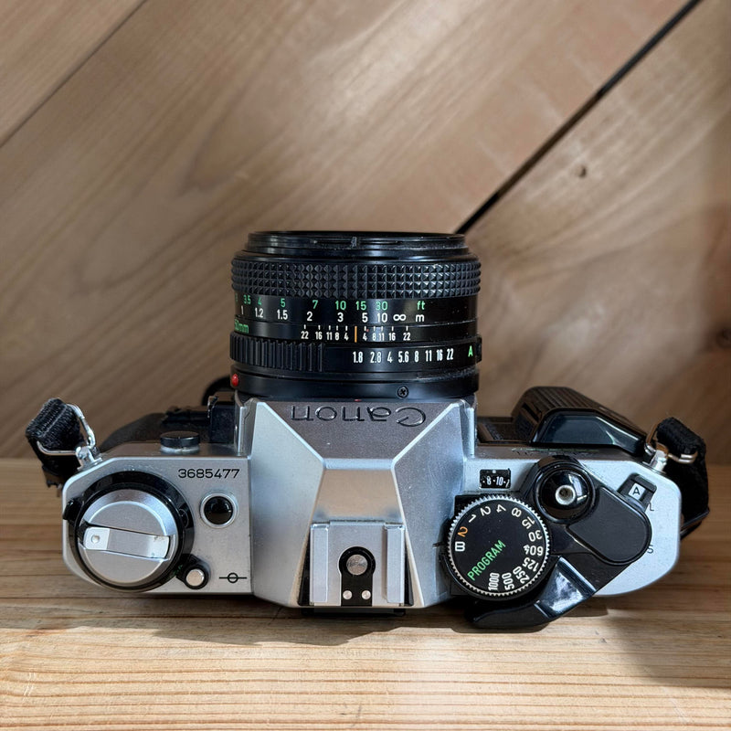 Canon AE-1 Program 35mm SLR Film Camera w/ Canon FD 50mm f/1.8 Lens (3685477)