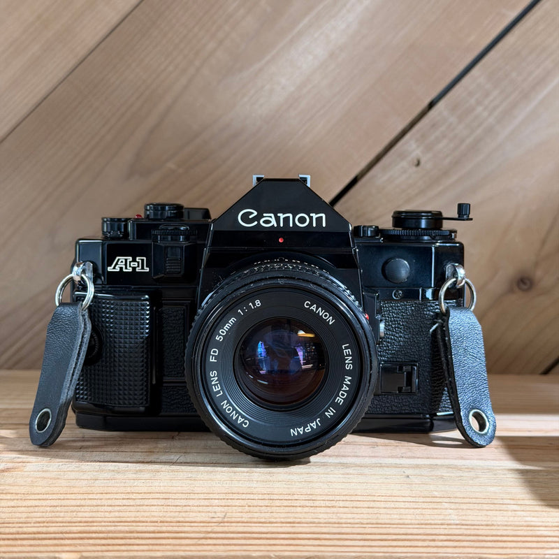 Canon A-1 35mm SLR Film Camera w/ Canon FD 50mm f/1.8 Lens (552002) (Black Body)