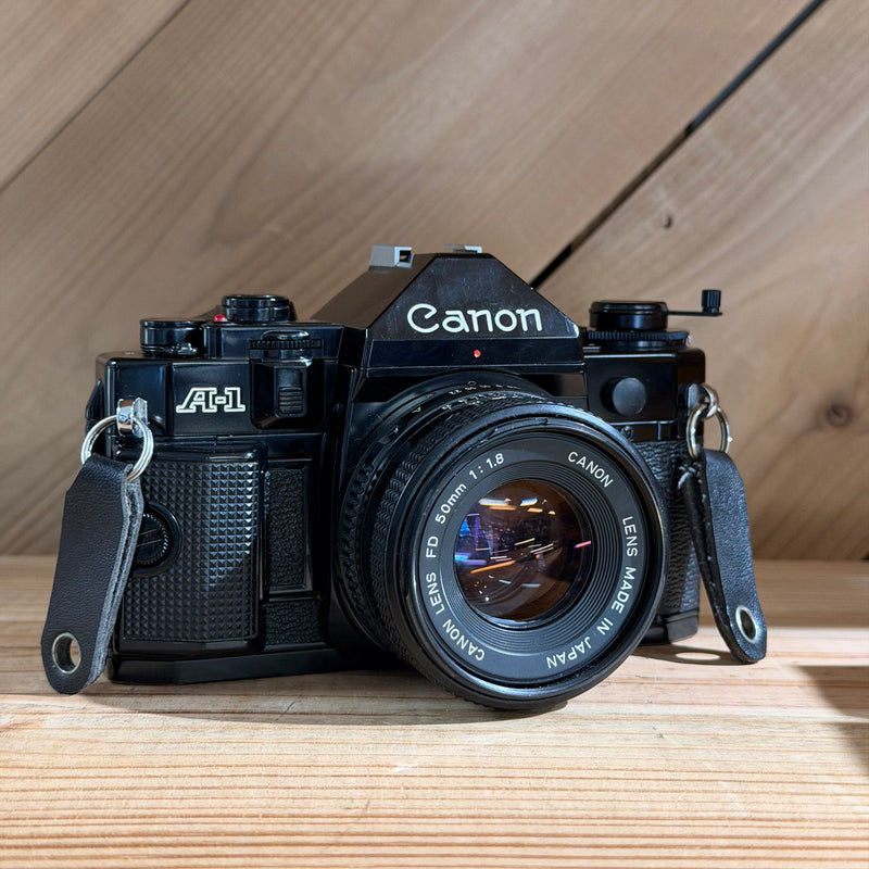 Canon A-1 35mm SLR Film Camera w/ Canon FD 50mm f/1.8 Lens (552002) (Black Body)