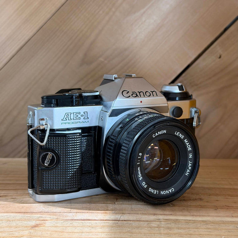 Canon AE-1 Program 35mm SLR Film Camera w/ Canon FD 50mm f/1.8 Lens (4504026) (Silver Body)