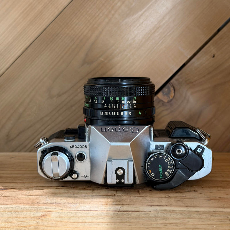 Canon AE-1 Program 35mm SLR Film Camera w/ Canon FD 50mm f/1.8 Lens (4504026) (Silver Body)