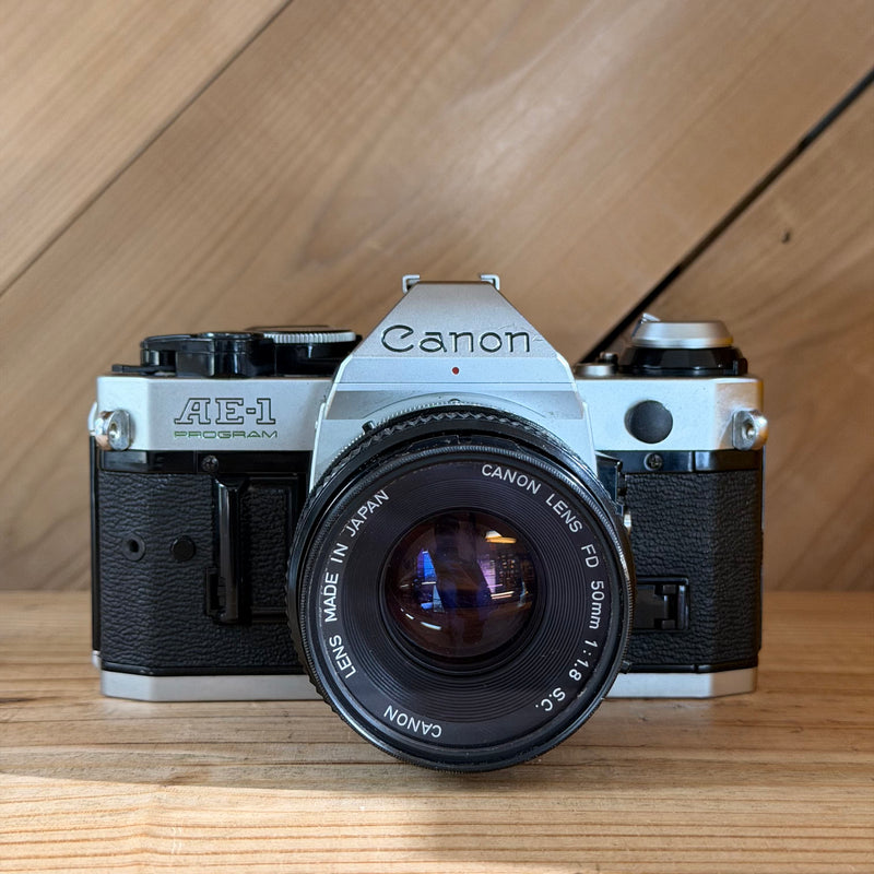Canon AE-1 Program 35mm SLR Film Camera w/ Canon FD 50mm f/1.8 Lens (1776571)