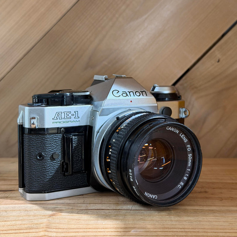 Canon AE-1 Program 35mm SLR Film Camera w/ Canon FD 50mm f/1.8 Lens (1776571)