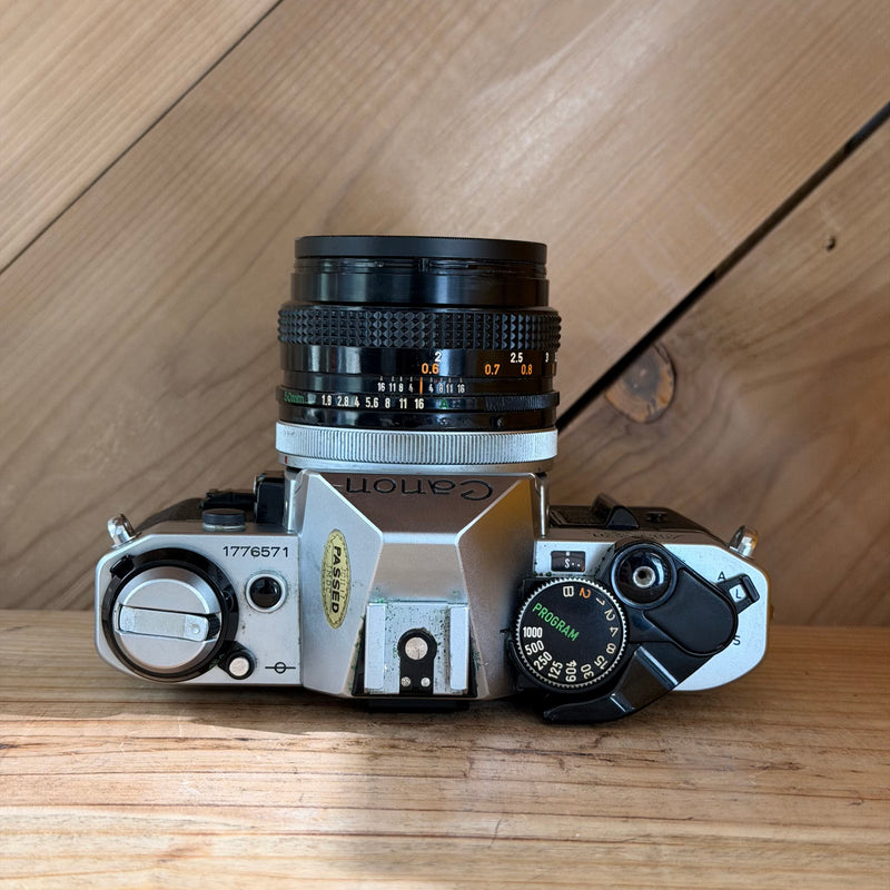 Canon AE-1 Program 35mm SLR Film Camera w/ Canon FD 50mm f/1.8 Lens (1776571)