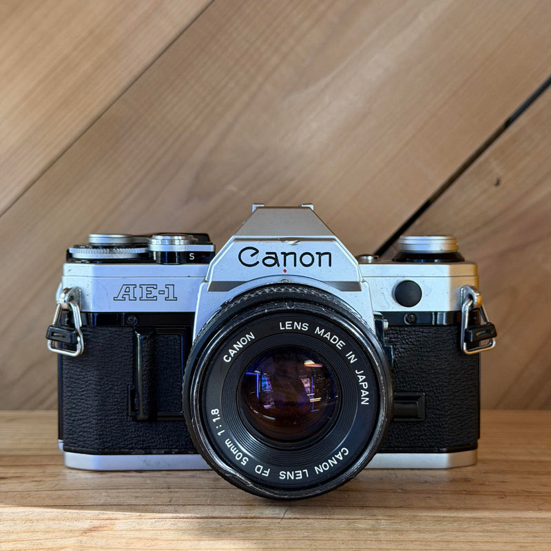 Canon AE-1 35mm SLR Film Camera w/ Canon FD 50mm f/1.8 Lens (160071) (Silver Body)