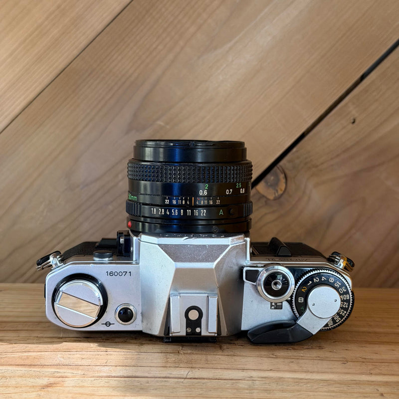 Canon AE-1 35mm SLR Film Camera w/ Canon FD 50mm f/1.8 Lens (160071) (Silver Body)