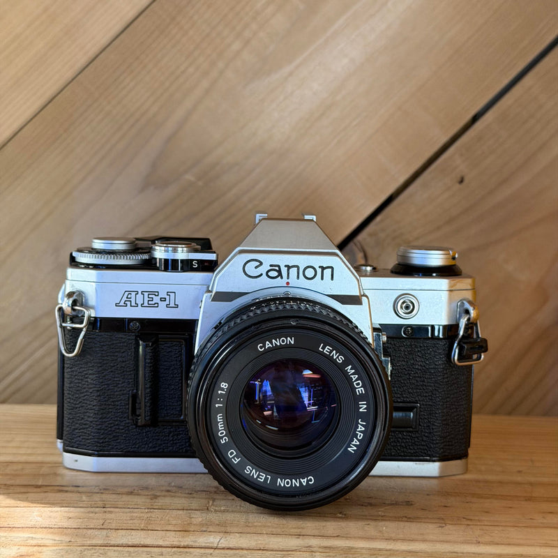 Canon AE-1 35mm SLR Film Camera w/ Canon FD 50mm f/1.8 Lens (591025) (Silver Body)