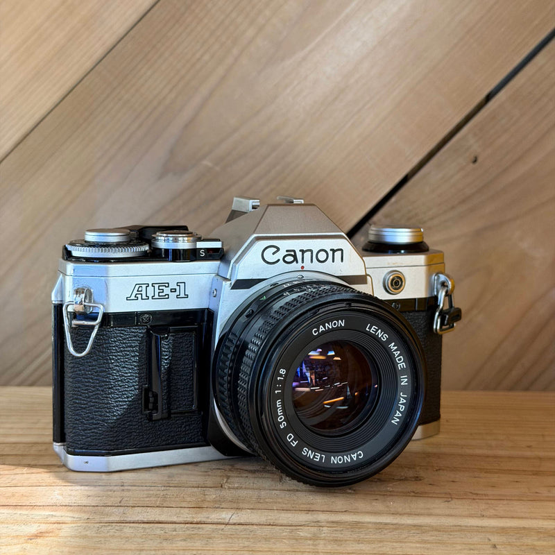 Canon AE-1 35mm SLR Film Camera w/ Canon FD 50mm f/1.8 Lens (591025) (Silver Body)