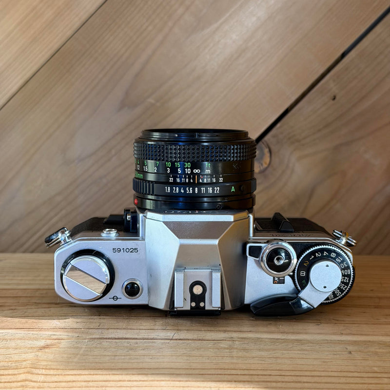 Canon AE-1 35mm SLR Film Camera w/ Canon FD 50mm f/1.8 Lens (591025) (Silver Body)