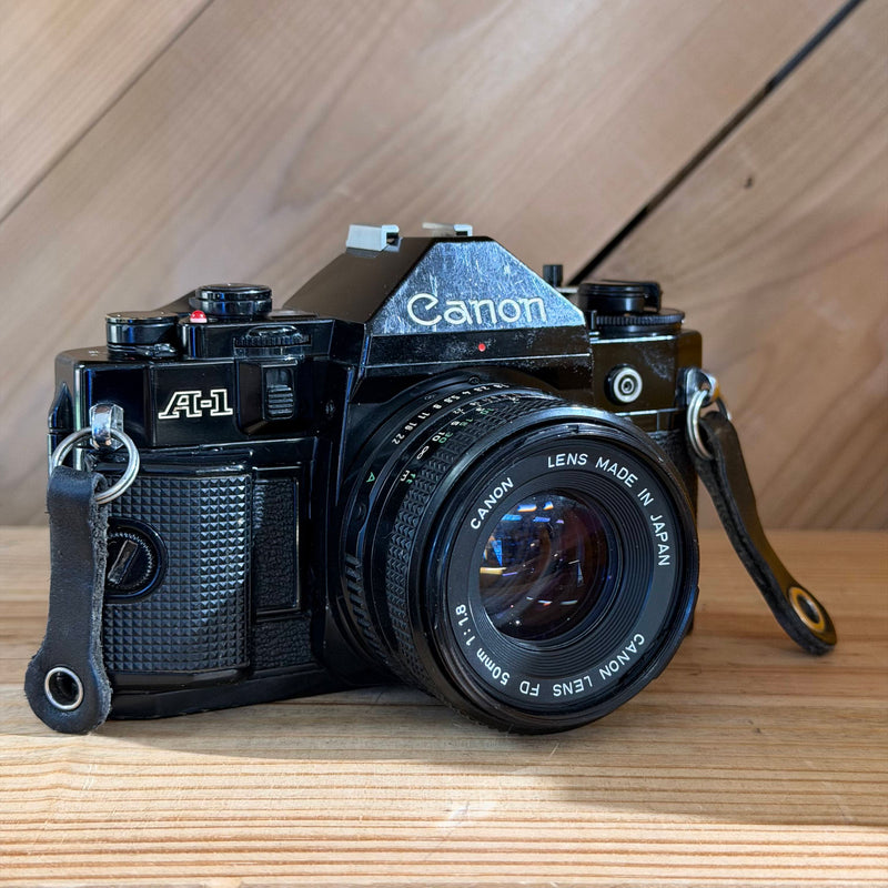 Canon A-1 35mm SLR Film Camera w/ Canon FD 50mm f/1.8 Lens (1305502) (Black Body)