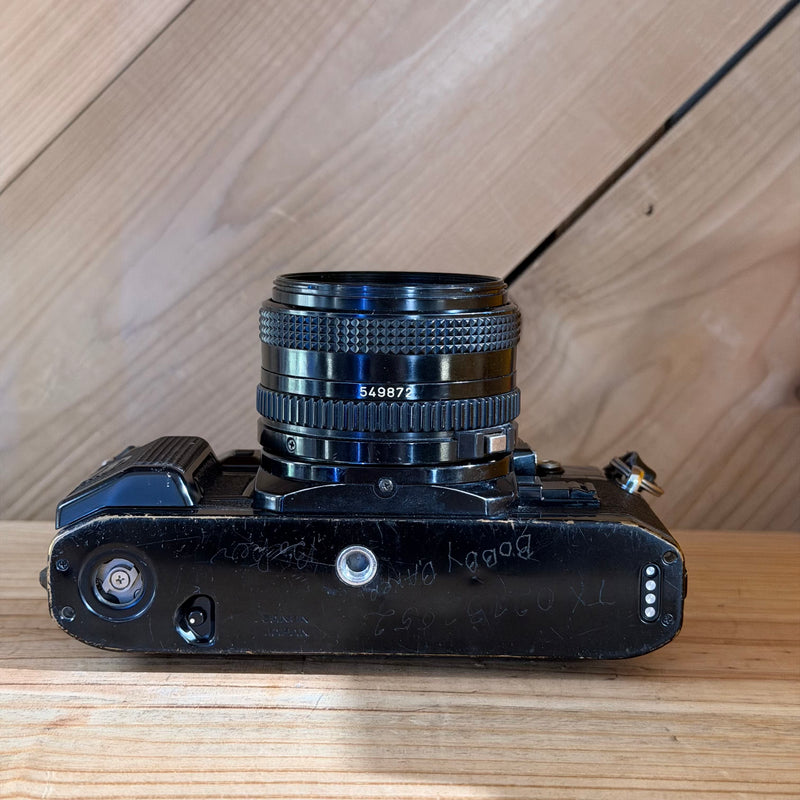 Canon A-1 35mm SLR Film Camera w/ Canon FD 50mm f/1.8 Lens (1305502) (Black Body)