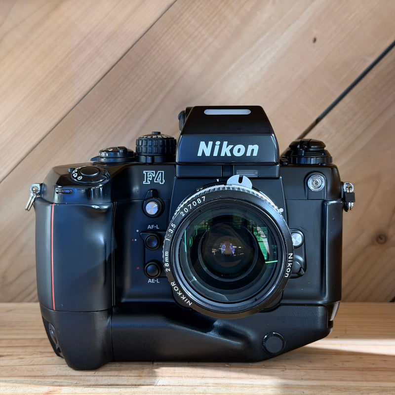 Nikon F4 35mm Professional SLR Film Camera w/ Nikkor 28mm f/3.5 Lens (US 2461747)