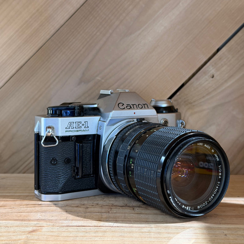 Canon AE-1 Program 35mm SLR Film Camera w/ Sigma Zoom 35–70mm f/2.8–4 Lens (1703074)