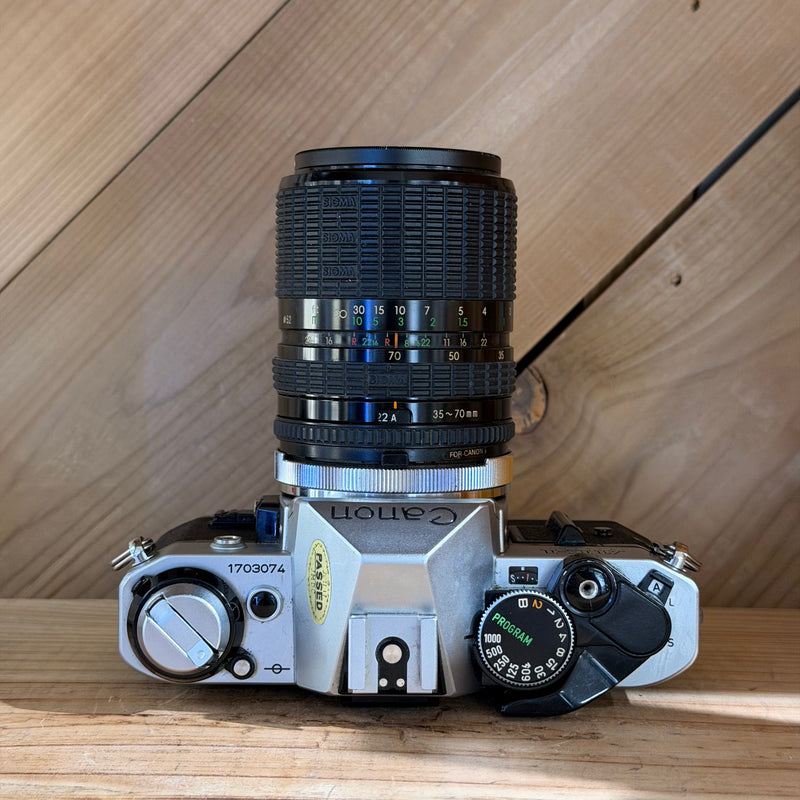 Canon AE-1 Program 35mm SLR Film Camera w/ Sigma Zoom 35–70mm f/2.8–4 Lens (1703074)