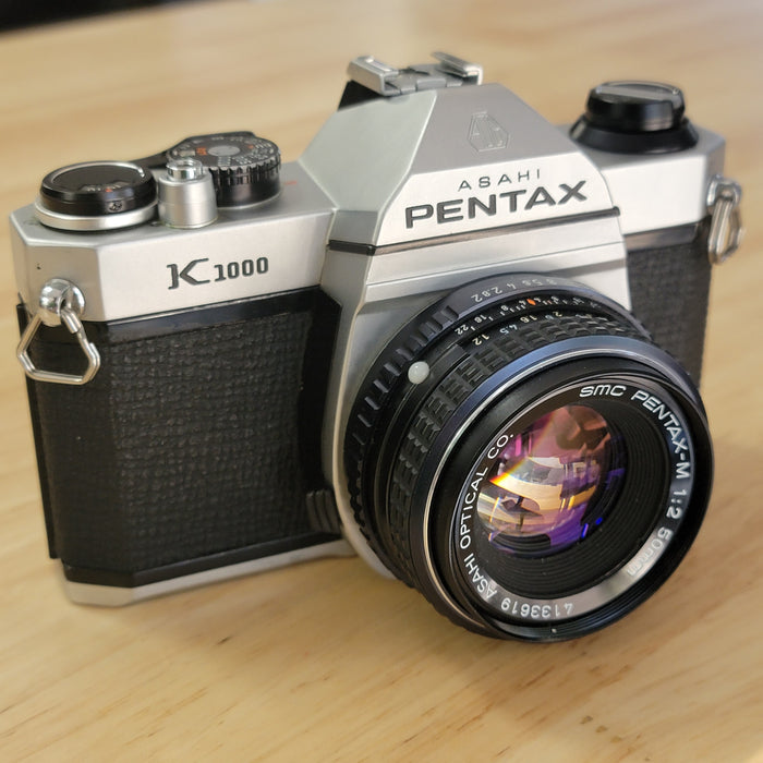 Pentax K-1000 SLR w/ SMC Pentax-M 50mm 1:2 lens (blemished)